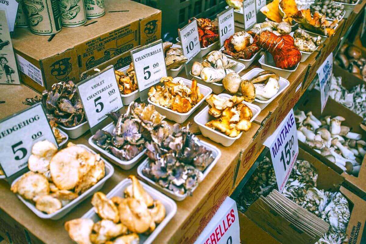 Mushrooms at a market illustrating mushrooms benefits for women.